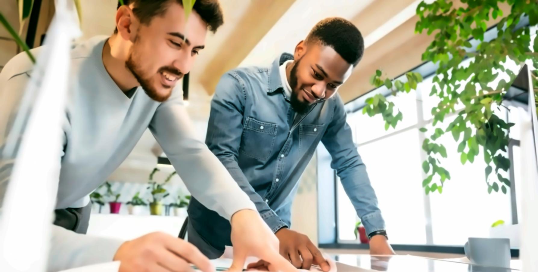 Finance team reviewing detailed budget spreadsheets and financial charts on multiple monitors
